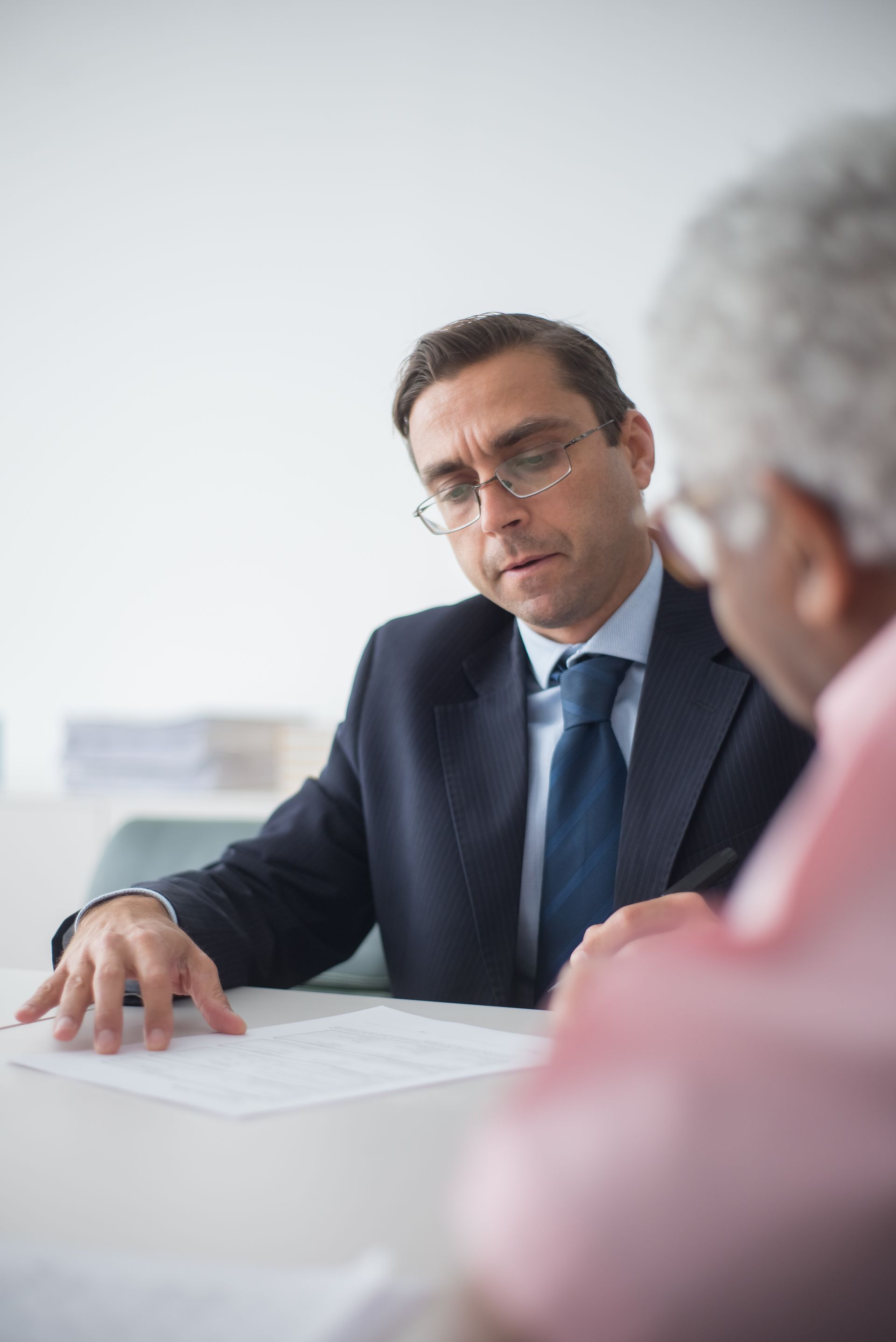 Advisor reviewing documents with a client